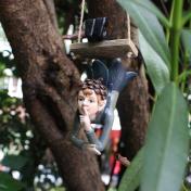 Fairy Garden Walnut Boy Swinging Sculpture